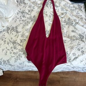 Size Small open back V cut Express thong bodysuit. Tag is cutoff